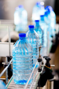 Plastic bottles moving down a conveyor RSE Denver